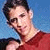 A split-screen image with a person in a red shirt on the top left and a person in a blue shirt on the bottom left, next to pixelated text on a blue background.