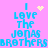 Pixelated blue text on pink background reads "I LOVE THE JONAS BROTHERS" with yellow heart and starburst symbols in two variations.