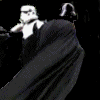Animated sequence of two figures in white armor and black cloaks moving against a solid black background.