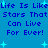 Blue background with repeated text 'Life Is Like Stars That Can Live For Ever!' in dark blue pixelated font, scattered light blue star shapes.