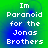 Four identical pixelated text arranged in a on a green-to-blue gradient background, each displaying "Im Paranoid for the Jonas Brothers" in white block letters
