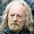 A split-frame contact sheet showing a pixelated portrait of an older man with long white hair on the left and green text reading "Original Icons .com" on a dark green background on the right.