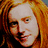 Four- with three people and text; top-left person has red hair, top-right person wears glasses, bottom-left person has dark hair, bottom-right displays cyan text on black background