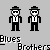 Two pixelated figures in black suits with white shirts and ties stand side-by-side against a gray background, each wearing a dark fedora and sunglasses.