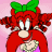 Pixelated cartoon character with red hair, green bow, and pink background wearing a red outfit with light-colored accents.