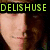 Pixelated image with green text 'DELISHUSE' above a person's face and 'AAAAAA' over a hamburger graphic.