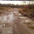Static pixelated image showing indistinct light and dark brown tones with no clear subjects or text.