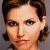Static pixelated image of a person's face with short dark hair, light skin tone, and neutral expression against gray background.