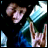 A four- shows a person with light brown hair and blue clothing making hand gestures, with text overlays changing between