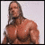 A muscular man with long brown hair appears in three distinct poses across a , each showing different angles and expressions