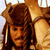 Pixelated static image of a person wearing a brown fur-trimmed hat with ear flaps and long dark hair, set against a light background.