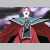 Pixelated figure with teal and red clothing, white circular head, and dark limbs against a gradient background.