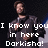 Pixelated image of a person in dark clothing with text overlay reading 'I know you in here Dorkisha!' against a black background.