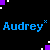 Pixelated text 'Audrey' in blue and purple with small X symbols, surrounded by scattered colored squares on a black background.