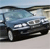 A pixelated static image shows a dark-colored sedan with visible headlights and side mirrors against a light background.