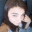 A person with brown hair holds a phone to their ear, with text appearing below the image.