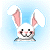 Pixelated bunny head with pink inner ears, black eyes, and a smiling mouth against light blue background.