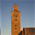 A tall, narrow, pixelated tower with multiple rectangular openings against a gradient sky background.