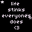 Black background with white pixelated text reading "life stinks everyones does <3" and small gray stars scattered throughout.