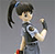 Pixelated cartoon character with dark hair in a high ponytail tied with blue band, wearing dark sleeveless top and light pants, holding a black object near face, red mark on forehead, gray background.