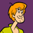 Pixelated cartoon character with orange hair and yellow shirt against purple background, static single-frame image.