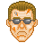 Pixelated face with brown hair, dark sunglasses, and orange scorch marks on forehead and cheeks against gray background.
