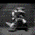 Animated sequence of a stylized character with a large head and rounded body performing a spinning motion against a dark background.
