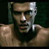 A shirtless man with light-colored hair and visible scratches on his face and chest appears in four showing changing facial expressions and head positions