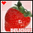 Pixelated strawberry with green leaves, red heart icon in top-left corner, 'DELICIOUS' text at bottom on light pink background.