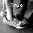 Black-and-white pixelated image of a person's lower body in motion, with text changing from "True" to "love" over the legs.