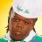 Pixelated image of a person wearing white headwear with green symbols, against yellow and black backgrounds with text.