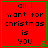 Red square with green border containing black pixelated text 'all i want for christmas is you' and small green tree icon in bottom-right corner.