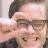 Pixelated image of a person with glasses and hand near head next to text "I'm crushing your head" on light background.