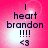 A pink background with a bright white light effect, displaying text 'I heart brandon !!!! <3' in dark blue pixelated font.