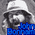 A 3x3 contact sheet of pixelated black-and-white images featuring Led Zeppelin band members and the band name, with blue text labels for each member's name.
