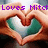 Two hands form a heart shape around a green and white object, with purple text above reading "Loves Mitch" on the left frame and partial date text on the right frame.