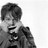 Static grayscale buddy icon showing a person with short hair wearing a jacket, partially cropped on the right side against a white background.