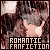 A pixelated image of a person with dark hair and light skin, wearing a white top, making a hand gesture near their face.