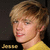 Static pixelated image of a person with light brown hair wearing a yellow shirt against dark background, likely from early 2000s digital media.