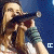 A static image of a person singing into a microphone with repeated text overlays and star symbols on a blue background.