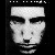 Black-and-white pixelated face with dark hair, eyes closed in first frame, then opening and shifting expression