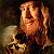A pixelated buddy icon featuring a character with long hair holding a skull on the left and green text reading "Original Icons .com" on a dark green background.
