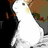 A pixelated image shows a white figure with brown hair and green clothing against a black background, partially cropped on the left side.