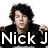 A pixelated image of a person with dark curly hair wearing a black jacket over a gray shirt, with text overlays reading "Nick J Is Hot" across three