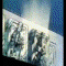 Animated sequence of a character in light blue attire performing actions against dynamic backgrounds including mechanical structures and energy effects.