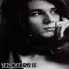 A black-and-white of repeated images showing a person with dark hair resting their chin on a hand, with text below each image