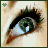Animated close-up of a green-eyed human eye with long dark lashes, showing subtle eyelid movement against light skin.
