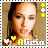 Alicia Keys avatar with changing facial expression, yellow hearts, and star symbols on a beige background.
