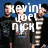 Four individuals in dark clothing stand against a blue background with large white text overlaying their faces.