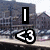 A pixelated urban scene with a black vertical bar and a white '<3' symbol on the left, and the text 'Poughkeep' on the right.